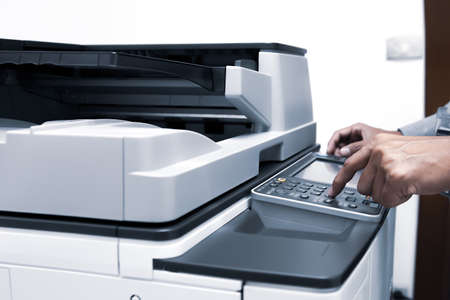 149472871-businessman-press-the-button-using-the-photocopier-or-printer-is-office-worker-tool-equipment-for-sc